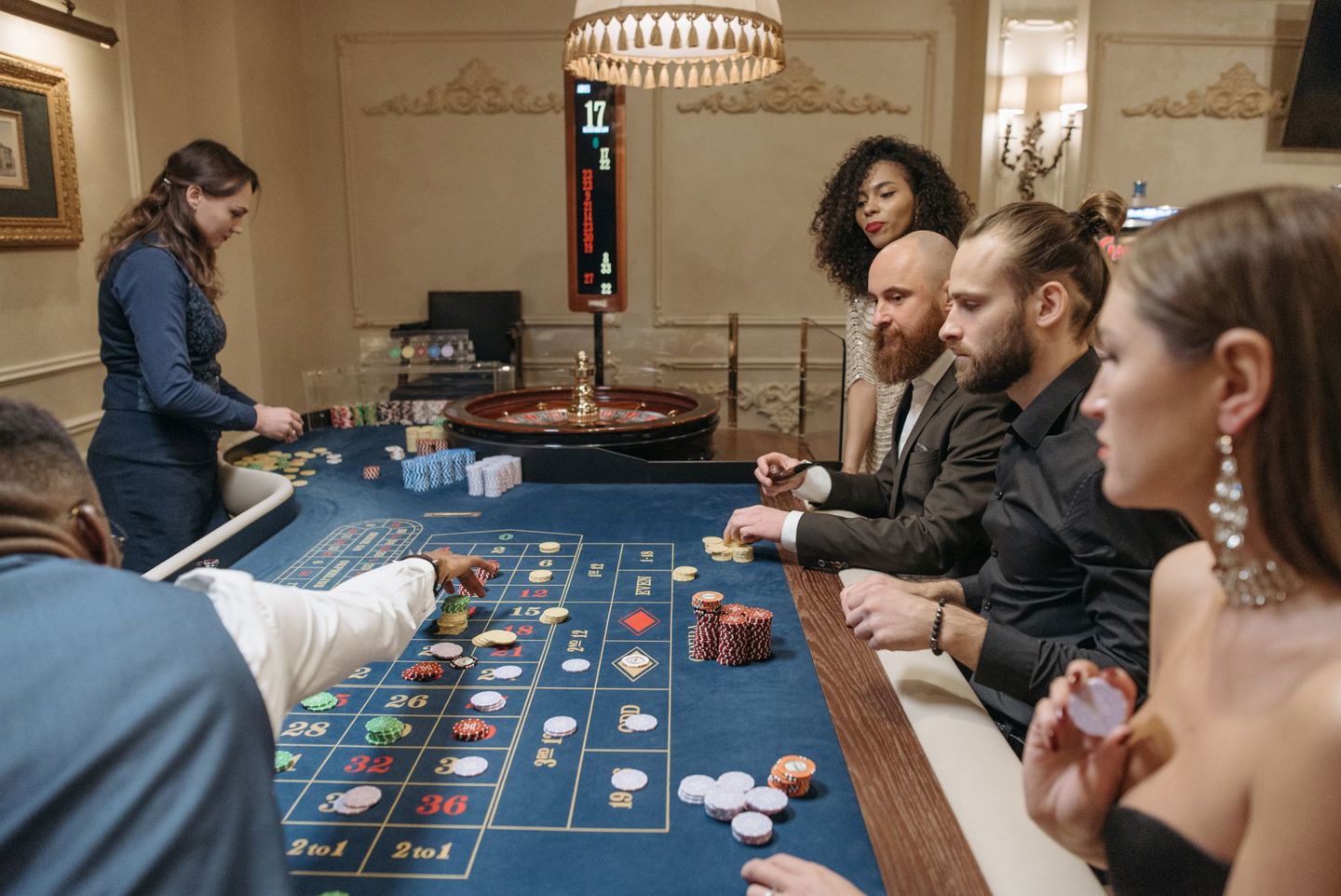 Canada's Online Casino Boom Is Bigger Than Anyone Expected Players placing chips on a roulette table at a casino